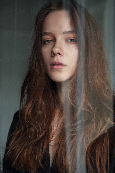 Portrait Of A Sensual Girl Behind The Glass By Stocksy Contributor