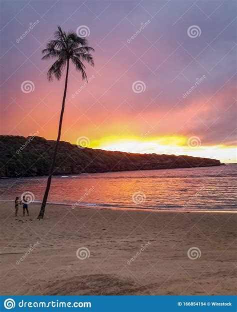 Vertical Shot Of A Breathtaking Sunset Over The Ocean At The Tropical