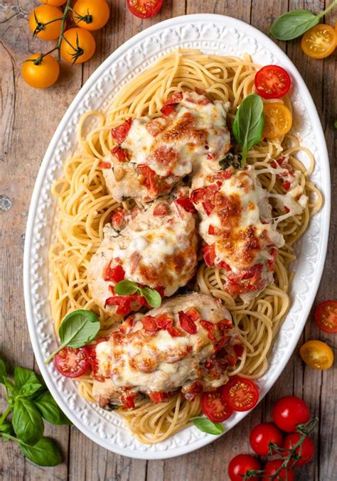 This bruschetta chicken pasta from delish.com is going to change your life. Cheesy Bruschetta Chicken Recipe - The Cookie Rookie (VIDEO!)