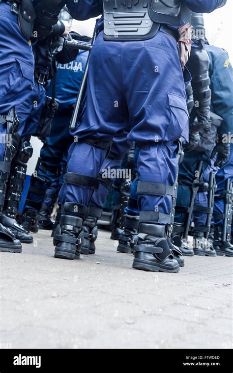 Unit Of Police Special Forces In Riot Gear Waiting For Orders Stock