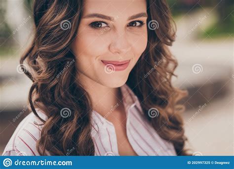 Cropped Close Up Of Beautiful Young Girl With Curly Brunette Hair Smiling Wearing White Casual