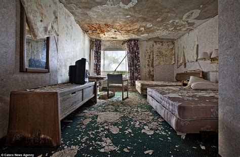 In This More Modern Hotel Room The Walls And Ceiling Are Deteriorating Rapidly While The
