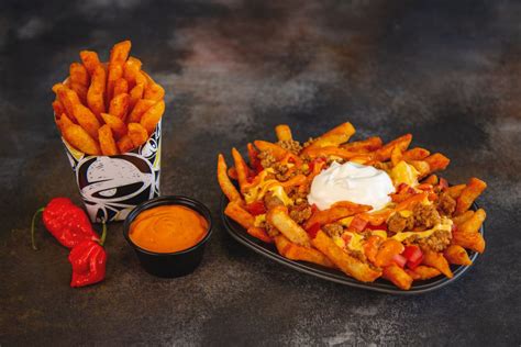 The first official franchise was opened in 1964 in torrance, california. Taco Bell Is Topping Its Nacho Fries With the World's ...