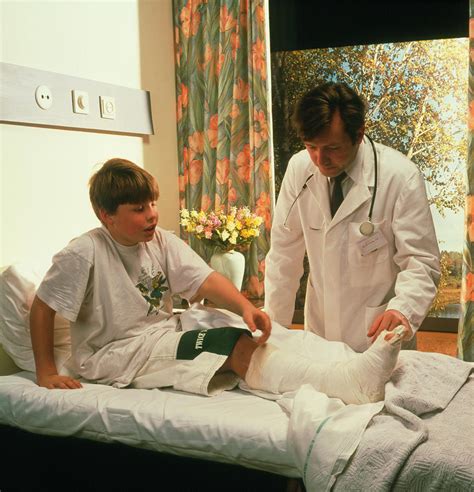 Boy In Hospital With Plaster Cast On Leg Photograph By Cc Studio