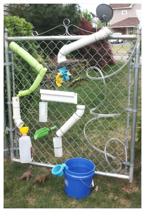 Hardwood floors and a wall of windows overlooking the backyard. DIY Water Wall For Summer STEM | Little Bins for Little Hands