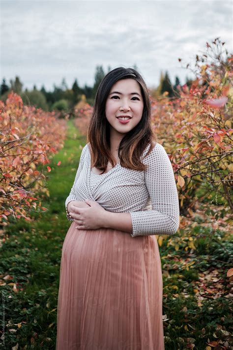 Portrait Of Pregnant Asian Woman Outdoor In A Park By Stocksy Contributor Take A Pix Media