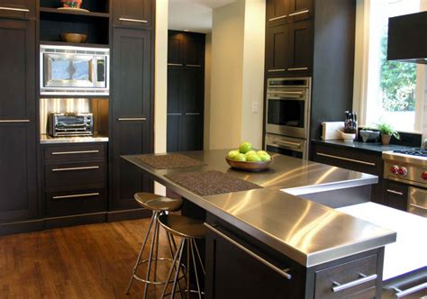 Browse photos of kitchen design ideas. Sleek Stainless Steel Countertop Ideas Guide | Luxury Home Remodeling | Sebring Design Build