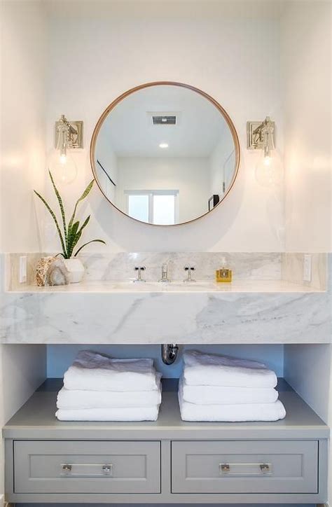Large floating cabinet in a dark shade and a contrasting white. Elegant floating marble vanity designed with gray drawers ...