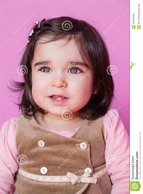 Cute Pretty And Happy Baby Girl Toddler Smiling Portrait Stock Photo