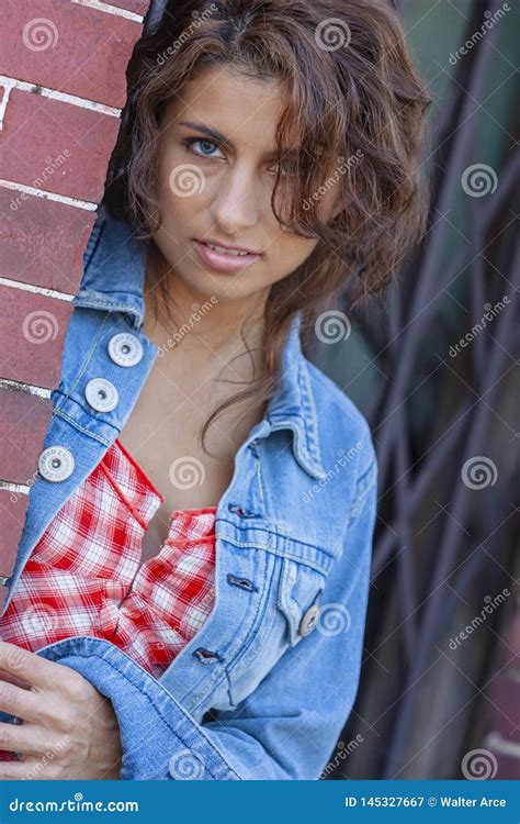 A Lovely Brunette Model Posing Outdoors With The Latest Fashions Stock Image Image Of Fashion