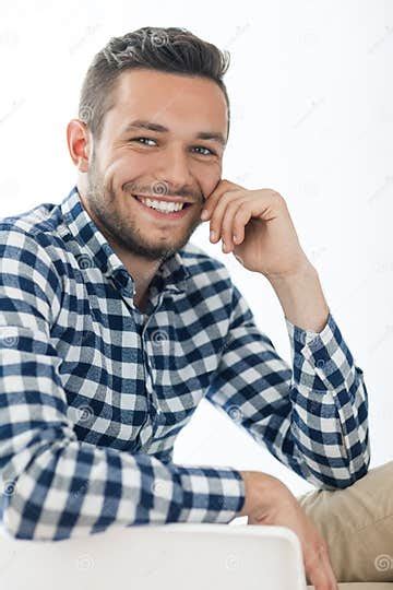 Portrait Of Handsome Smiling Man Sitting On Chair Stock Photo Image