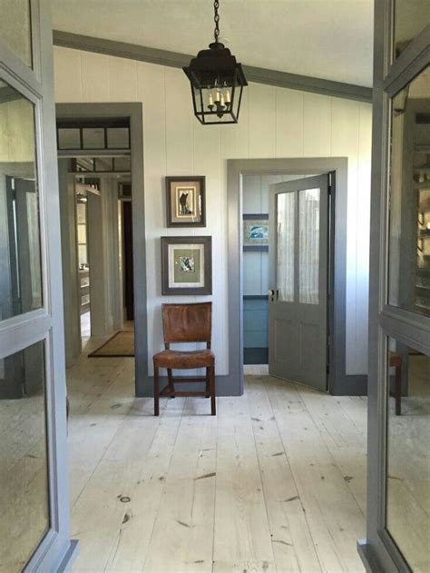 It's easy to create wall painting designs yourself that look beautiful even if you don't think you're artistic. Light cream paint dark grey greige trim | Grey interior ...