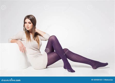 Beautiful Woman With Long Legs Wearing Stockings Posing In The Studio Full Body