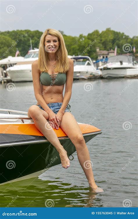 Beautiful Bikini Model Relaxing On A Boat By The Docks Stock Image Image Of Ocean Boat