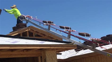 Portable Lift Conveyor In Use For Roofing Tiles Youtube