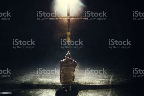 Man Kneeling Before The Cross Stock Photo Download Image Now Istock