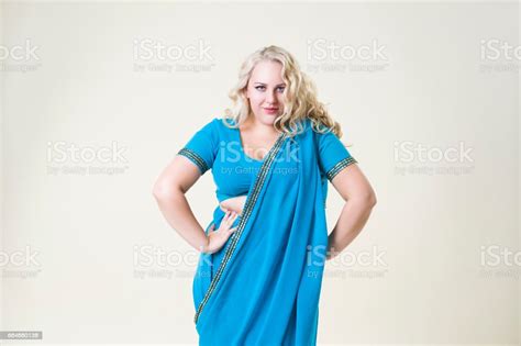 Plus Size Fashion Model Woman On Beige Background Overweight Female