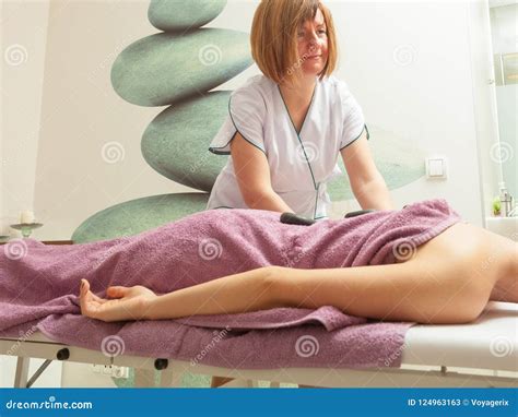 Female Masseuse Doing Massage With Hot Stones Stock Image Image Of Rocks Body 124963163