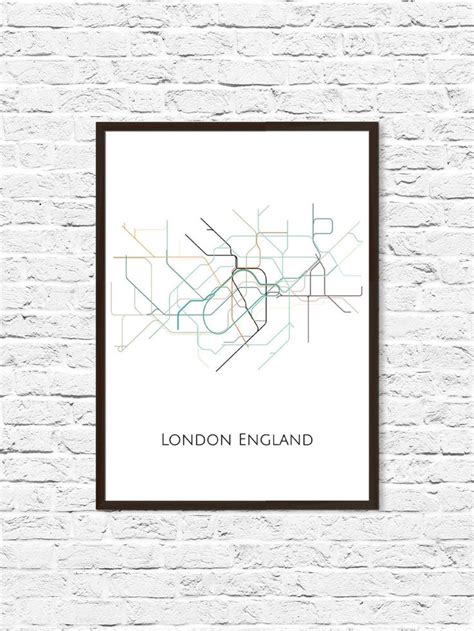 A White Brick Wall With A Black Frame On It And The London England Map
