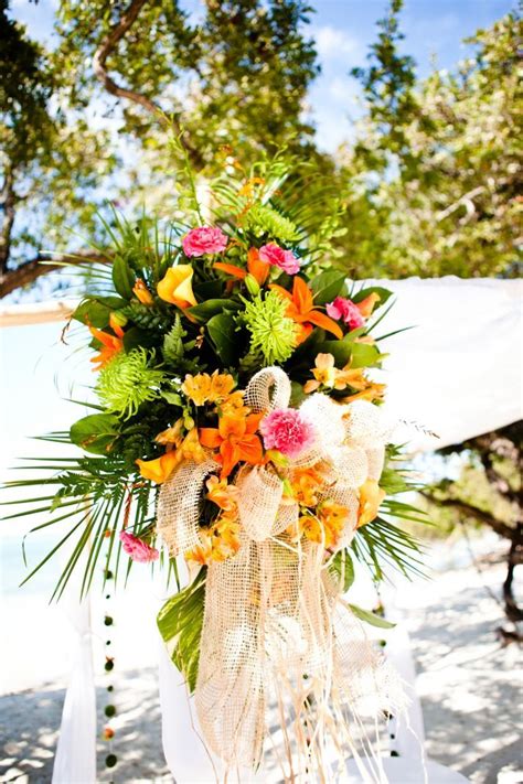 At vegas flowers delivery you get the most freshest and beautiful flower bouquets. Tropical beach wedding ceremony with orange and pink ...
