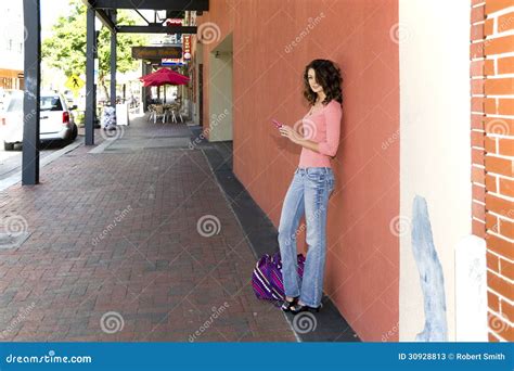 Woman On A Sidewalk Using A Cellphone Stock Image Image Of Outdoors