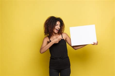 White background with horizontal lines. Business Concept - Close up Portrait young beautiful attractive African American smiling showing ...