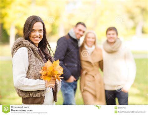 Group Of Friends Having Fun In Autumn Park Stock Photo Image Of