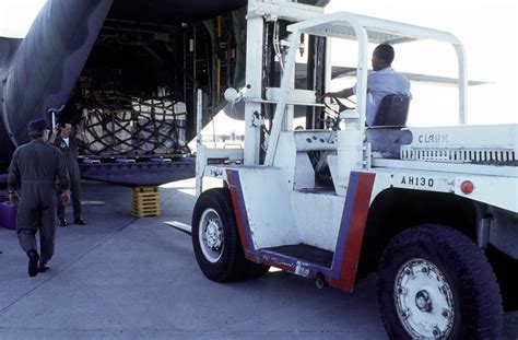 A Forklift Maneuvers In Back Of A 357th Tactical Airlift Squadron C