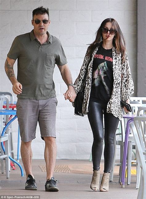 Megan Fox In Patterned Leggings Hoodie And Trainers As She Arrives At