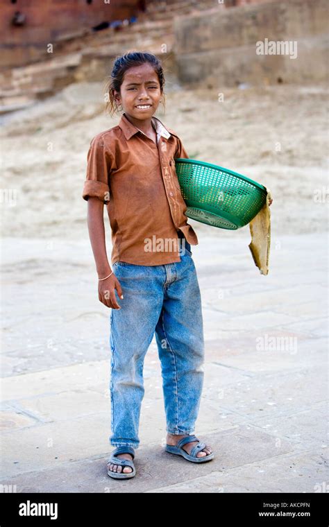 Portrait Of A Young Boy Selling Small Items From His Basket On The
