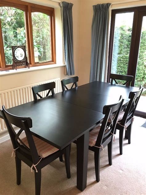 Black table measures 79 x 41 fully collapsed, 97 with one leaf, and 117 with both leaves. IKEA Stornas Extendable Table with 6 IKEA Ingolf Chairs ...