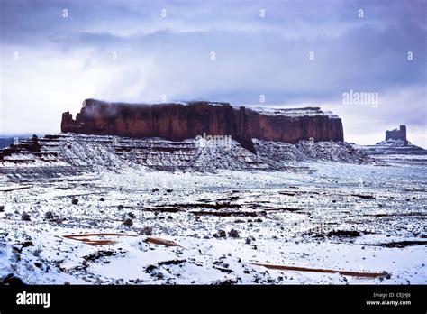 A Rare Captured Snowfall Across Monument Valley Tribal Park In Northern