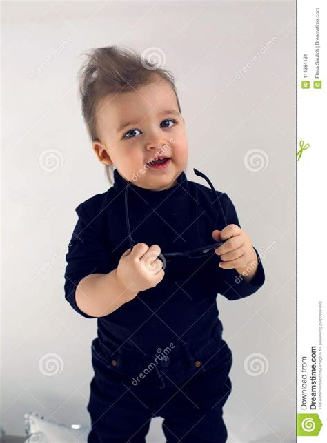 Stylish Baby Boy In Black Rocker Clothes And Sunglasses Stock Image