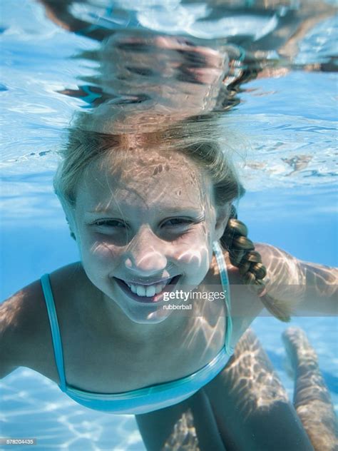 Girl Swimming Underwater In Pool High Res Stock Photo Getty Images