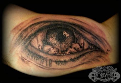 Horror Monster Like Big Black Ink Eye Tattoo On Arm Tattooimagesbiz