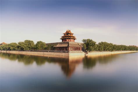 Brown Temple Near Lake Under Blue Sky During Daytime Photo Free