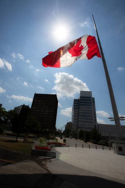 The practice is a sign of national mourning triggered by important events. Canadian Flag At Half Mast Stock Photos, Pictures ...