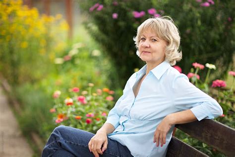 Mature Woman Smile Relax Garden Summer Nature Outdoors By Stocksy