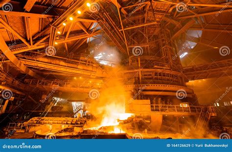 Steelworker Near A Blast Furnace With Sparks Foundry Heavy Industry