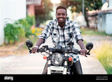African Biker Riding A Motorcycle With Smile And Happy Stock Photo Alamy