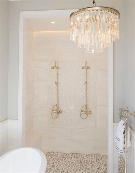 A Bath Room With A Tub And A Chandelier Hanging From Its Ceiling