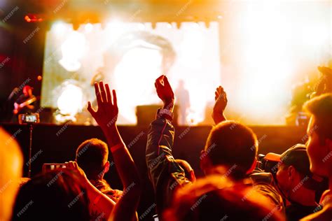 Premium Photo Srowd With Raised Hands At Music Festival Fans Enjoying