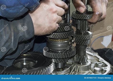 The Mechanic Installs The Primary And Secondary Shaft In The Housing Of