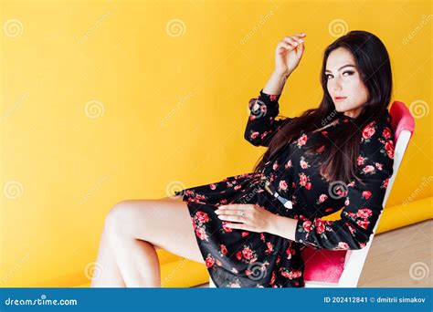 Beautiful Brunette Woman In Black Dress With Flowers Posing Stock Image Image Of Lady Beauty