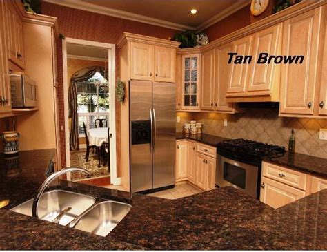 Grey kitchens will never go out of style. Tan brown countertops with light cabinets | Tan kitchen ...