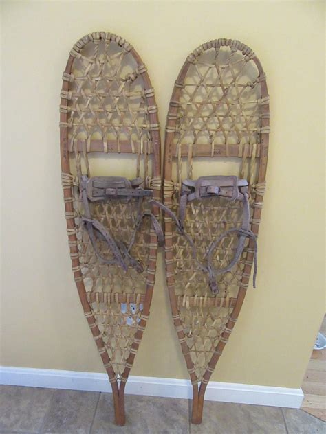 Two Canoes Made Out Of Wicker Hang On The Wall