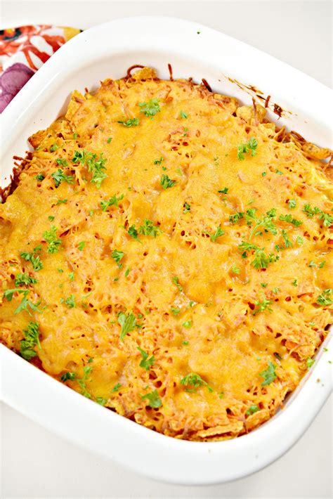 Mix together the rotel, sour cream, taco seasoning, cream of chicken soup, and part of the cheese. Chicken Dorito Casserole | Life She Has