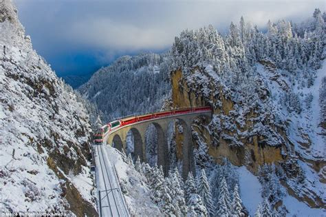 Train Piercing Through Snow Capped Mountains Of Highest Railway In