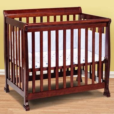 This mini crib comes with wheels, with which you can move it around. DaVinci Kalani Mini Crib in Cherry | Mini crib, Cribs ...