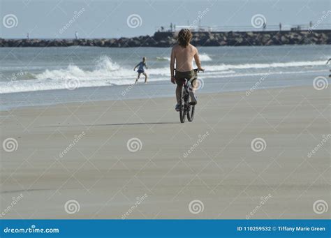 A Guy Riding His Bike On The Beach Editorial Photography Image Of Biking Coast 110259532